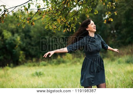 Portrait Of A Brunnete Happy And Smiling Girl