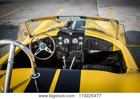 Great closeup view of classic retro vintage race car open cab and dashboard