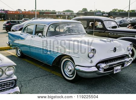 front and side view of old classic vintage retro car