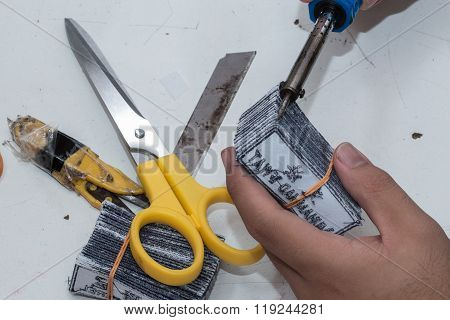 Using Soldering iron to burn the name tag to make it more nice