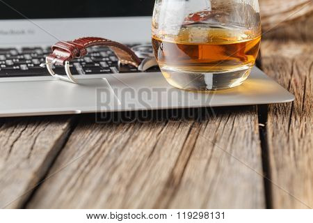 Whiskey Glass On Laptop