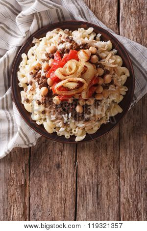 Egyptian Kushari Of Rice, Pasta, Chickpeas And Lentils Vertical Top View