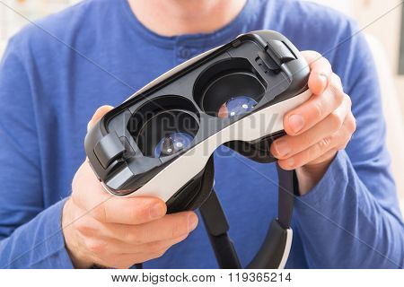 Man using virtual reality headset at home