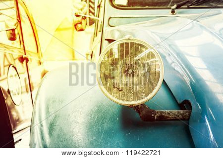 Close Up Of Headlight Lamp Vintage Classic Car. (vintage Effect Style)