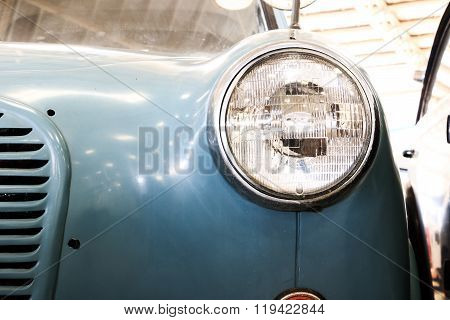 Close Up Of Headlight Lamp Vintage Classic Car. (vintage Effect Style)