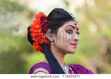 KOLKATA INDIA - MARCH 5 2015 : Young girl dancers performing at Holi / Spring festival known as Dol (in Bengali) or Holi (in Hindi) celebrating arrival of Spring in India. A very popular festival amongst Bengalis.