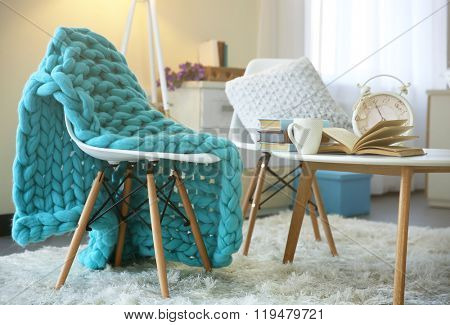 Room design with white furniture, picture and floor lamp over beige wall