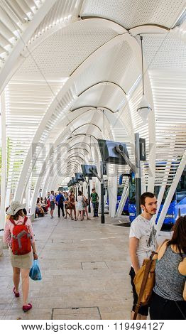 Tourist Waiting In Line For Bus At Central Bus Station