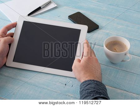 Man Holding Tablet In Hand With A Blank Screen