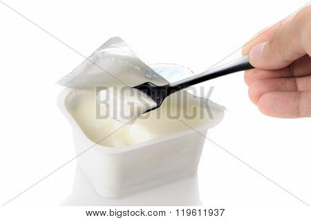 natural yogurt in white plastic container over white background