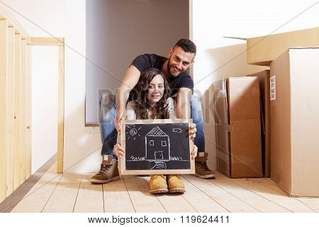 young happy couple moves into new home