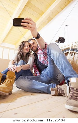 Pretty Young Couple Take A Selfie After Moving