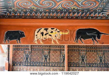 Toraja Traditional House Wood Carvings And Paitings With Different Buffaloes And Pig