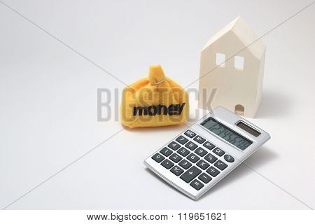 House, money, and calculator