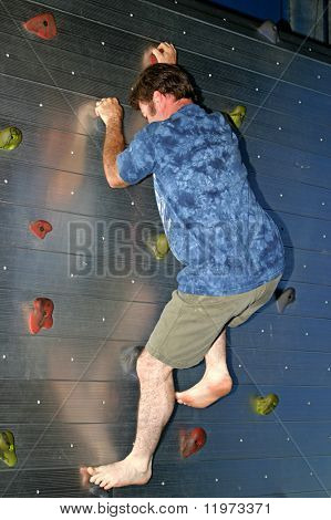 A man climbing a rock wall.