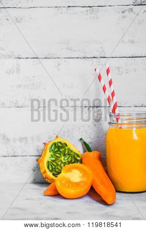 Orange Smoothie On Rustic Background