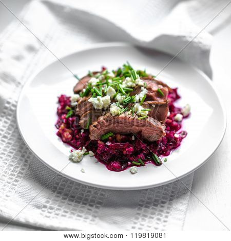 Beefsteak Wih Beets On Wooden Background