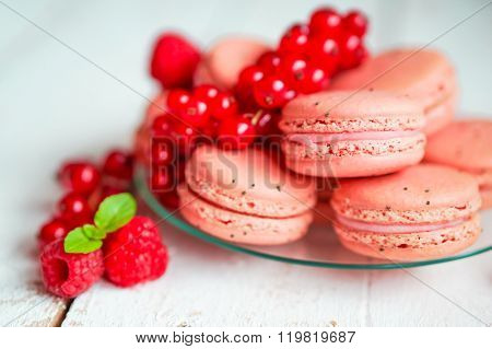 Raspberry Macaroons With Berries On Wooden Table