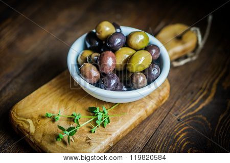 Olives On Rustic Wooden Background