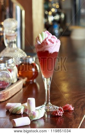 Fancy champagne cocktail with blood orange foam