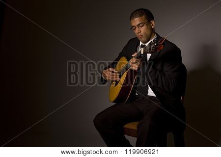fado musician with a portuguese guitar, studio