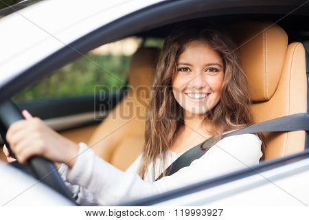 Young woman driving her car