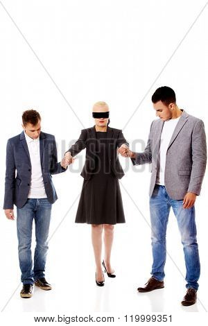 Business team-two men helping to blindfolded woman