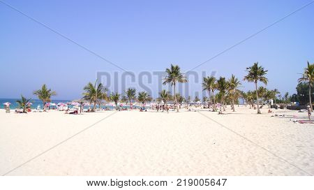 DUBAI, UNITED ARAB EMIRATES - APRIL 1st, 2014: Panoramic view on nice Al Mamzar beach, famous tourist destination with clear blue water of Persian gulf.