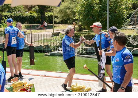 Rome Italy - July 30 2016: Dragon boat crews compete at the european championships held in Italy in 2016 summer compliments after the race