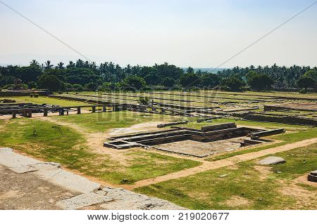 View of ancient stepwell from the platform of Mahanavami Dibba in Hampi, Karnataka, India. Stepwells were developed to cope with seasonal fluctuations in water availability.