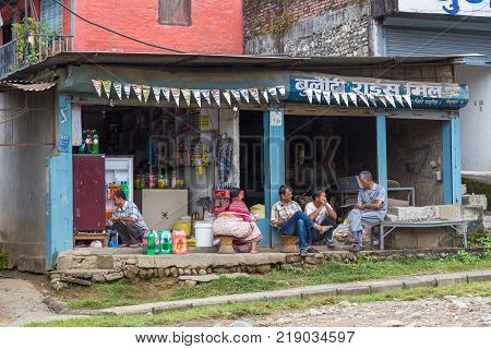 POKHARA NEPAL - October 02 2013: Local people on the street of Pokhara. Unidentified people walking through the colorful streets of Pokhara.