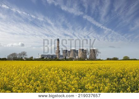 EGGBOROUGH POWER STATION WITH FIELD OF RAPE SEED YORKSHIRE ENGLAND