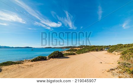 Dirt road by the sea in Caprera island Sardinia