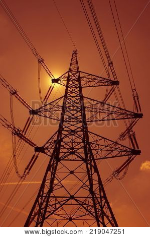Electricity Pylons In Silhouette At Sunest Drax Power Station Yorkshire England