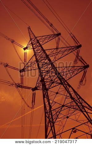 Electricity Pylons In Silhouette At Sunest Drax Power Station Yorkshire England