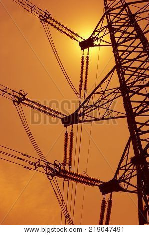 Electricity Pylons In Silhouette At Sunest Drax Power Station Yorkshire England