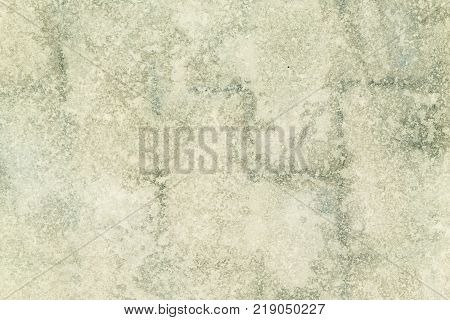 An unusual background of colored light green ice. An abstract picture of frozen water. Blurred texture.