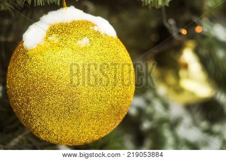 A huge Christmas tree toy snow amid trees