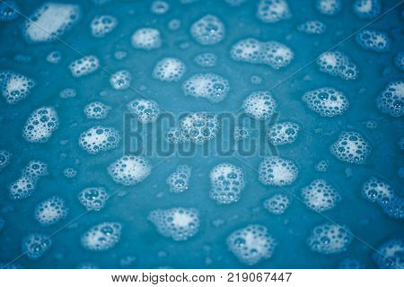 foam spots on blue water