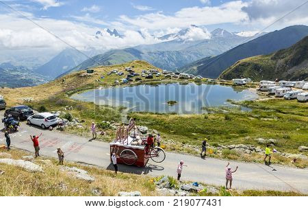 Col de la Croix de Fer France - 25 July 2015: Banette caravan driving on the road to the Col de la Croix de Fer in Alps during the stage 20 of Le Tour de France 2015. Banette is the leading brand for the artisan bread in France.