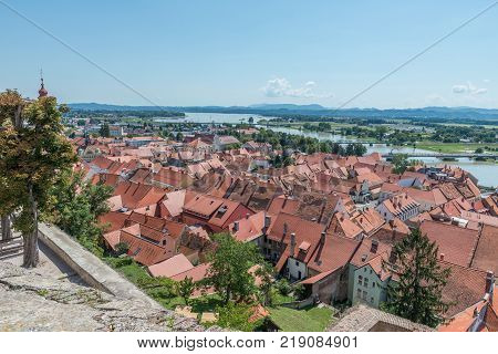 Ptuj / Slovenia - August 17, 2017: View of the old town, the river Drawa and the lake from the castle in Ptuj in the summer of 2017