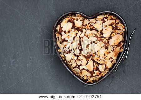 Valentines day dessert. Heart shaped chocolate cake in metal form tin