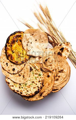 Assorted Indian Bread Basket includes chapati, tandoori roti or naan, paratha, kulcha, fulka, missi roti