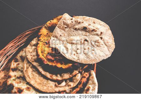 Assorted Indian Bread Basket includes chapati, tandoori roti or naan, paratha, kulcha, fulka, missi roti