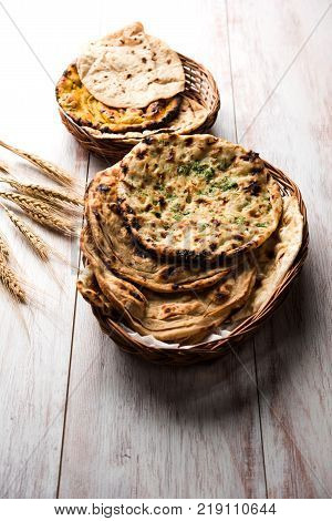 Assorted Indian Bread Basket includes chapati, tandoori roti or naan, paratha, kulcha, fulka, missi roti