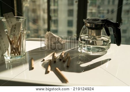 tea pot with measure tape and pencil on the working table working and rest concept