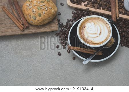 Morning coffeeLatte coffee in cup on tablevintage tone.