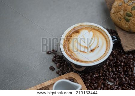 Morning coffeeLatte coffee in cup on tablevintage tone.