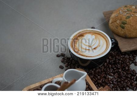 Morning coffeeLatte coffee in cup on tablevintage tone.