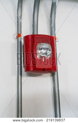 Red Fire alarm lighting against white background